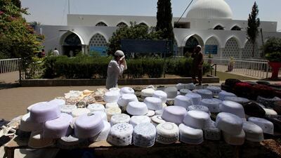 A boy wipes his face as he arrives to attend the first Friday prayers of the holy month of Ramadan at a mosque in Islamabad, Pakistan. Faisal Mahmood / Reuters