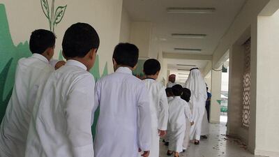 Students walk to their class at Al Aasimah School, boys government school in Abu Dhabi. Ravindranath K / The National