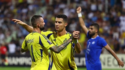 Cristiano Ronaldo and Marcelo Brozovic celebrate after Aymeric Laporte's goal for Al Nassr. Reuters