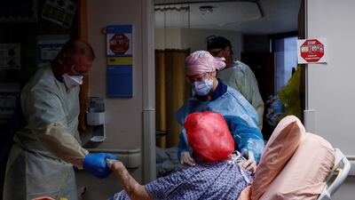 A medical team takes a coronavirus patient to a room at Sarasota Memorial Hospital in Florida, the US, on September 21. Photo: Reuters