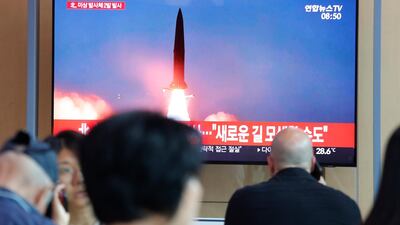 People watch a TV showing a file image of a North Korea's missile launch during a news program at the Seoul Railway Station in Seoul, South Korea, Tuesday, August 6, 2019. AP