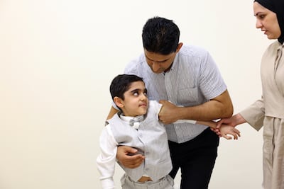 Yousef with his parents Hayder Al Waaeli and Jehan Ali. Chris Whiteoak / The National