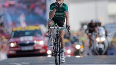 Thomas Voelcker of France signals his satisfaction with overcoming cramps to win Stage 10 of the Tour de France.