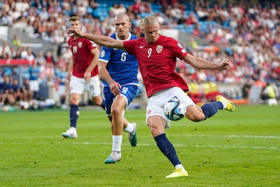 Norway's Erling Haaland, front and Cyprus's Alex Gogic battle for the ball. AP