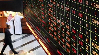 UAE stocks are set for inclusion into MSCI’s emerging markets index in May. Above, a trading board at the Abu Dhabi Securities Exchange. Delores Johnson / The National