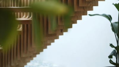 A central parametric staircase incorporates 700 hand-carved pieces of natural oak wood. Courtesy Ammar Basheir