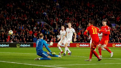 Aaron Ramsey of Wales scores his sides second goal. Reuters