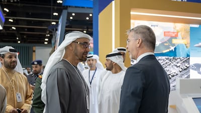 President Sheikh Mohamed visits a booth at Idex