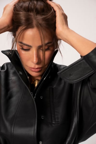 Leather jacket, Dh12,000; necklace, Dh7,570, both by Jacquemus