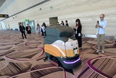 An automatic robot vacuum cleaning the floor at Changi. AFP