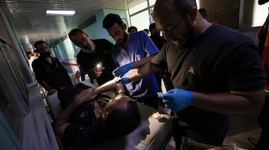 An injured person receives treatment at the National Hospital in Sweida during a power outage in the southern Syrian city caused by clashes between Bedouin tribes and Druze factions. Hasan Belal for The National July 24,2025