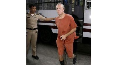 Michael Bryan Smith of England, arrives at the criminal court Thursday, Feb. 18, 2010, in Bangkok, Thailand. The court was in session to rule on a request by the United Arab Emirates to extradite Smith for allegedly embezzling US $150 million from a UAE company. (AP Photo/Sakchai Lalit) *** Local Caption *** SL102_Thailand_British_Extradite.jpg