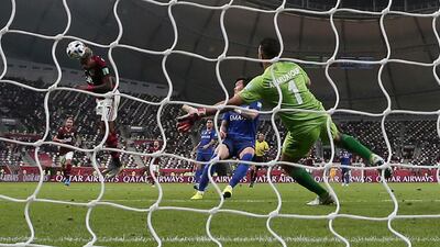Flamengo's Bruno Henrique, left, scores his side's second goal. AP