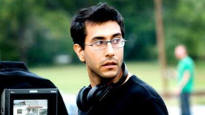 The director takes his place behind the camera.