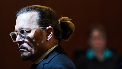 Depp gets up during a break in the courtroom on Wednesday. AP