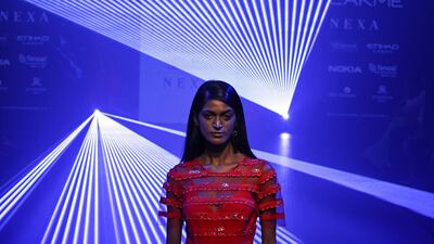 A model presents an outfit by designers Pankaj and Nidhi. EPA