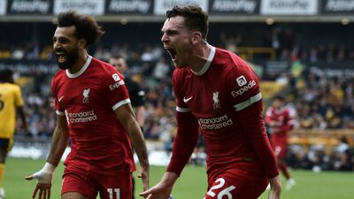 Andrew Robertson, right, celebrates with Mohamed Salah after scoring Liverpool's second goal in their 3-1 Premier League win over Wolves at Molineux on September 16, 2023. AP