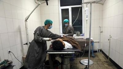 A man is treated at a hospital after a deadly attack at Kabul University, in Kabul. AP Photo