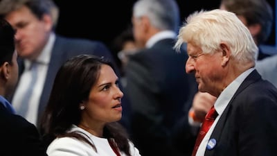 Priti Patel talks with Boris Johnson's father, Stanley. AFP