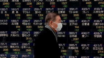 Asian shares rose to record highs on Friday, with Japan's Nikkei hitting a three-decade peak . / AFP PHOTO / Kazuhiro NOGI