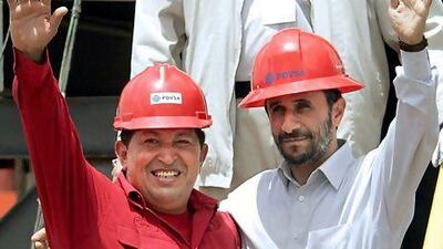 Hugo Chávez's economic impact was similar to that of fellow oil-fuelled authoritarian, Mahmoud Ahmadinejad. Fernando Llano / AP Photo
