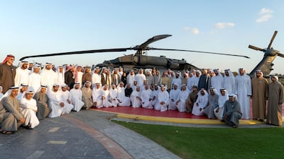 Sheikh Mohamed bin Zayed stands for a photograph with members of the UAE Armed forces and developers who worked on the new weapon system.