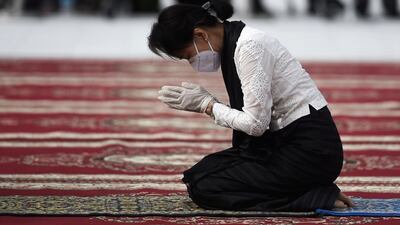 Myanmar State Counsellor and Foreign Minister Aung San Suu Kyi pays her respects to her late father during a ceremony to mark the 73rd anniversary of Martyrs' Day in Yangon. Reuters