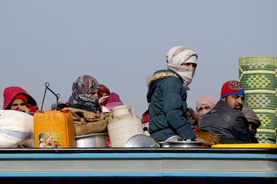 Syrian people return to their homes after the area was freed from ISIS in Hajin on February 2, 2019. AFP