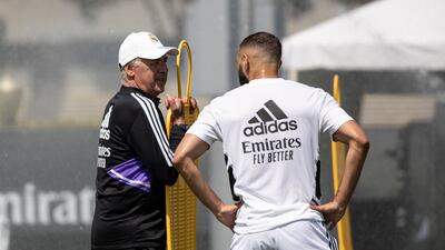 Real manager Carlo Ancelotti speaks to Karim Benzema in Los Angeles. EPA