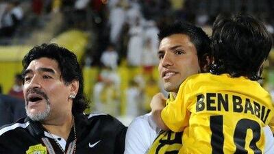 Diego Maradona, left, has brought global attention to Al Wasl. Last night he was joined by his son in law, Manchester City's Sergio Aguero, centre, and his grandson Benjamin.