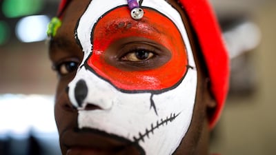 David Prince poses for a photo with his face painted for the Carnival parade in Port-au-Prince, Haiti. AP Photo