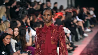 Take a bow: Elie Saab presented a collection resplendent with pussy-bow gowns, dresses and blouses at Paris Fashion Week on February 29. Photo: EPA