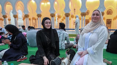 Worshippers wait for the start of iftar at the mosque. Victor Besa / The National