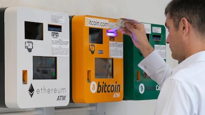 Bitcoin's fall from $19,000 late last December to $6,000 has not deterred investors. Kin Cheung / AP