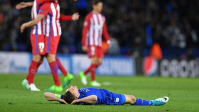 A dejected Jamie Vardy lies on the pitch following Leicester City's Uefa Champions League quarter-final elimination to Atletico Madrid at the King Power stadium in Leicester, England, on April 18, 2017. Ben Stansall / AFP