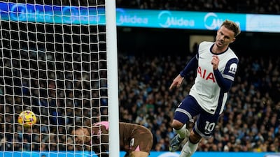Tottenham's James Maddison scores the opening goal against Manchester City at the Etihad Stadium. AP
