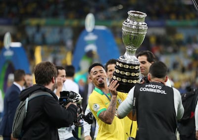 Gabriel Jesus celebrates winning the Copa America with the trophy. Reuters