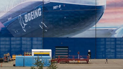 A worker walks outside of a Boeing facility in Everett, Washington, US, on Wednesday, May 27, 2020. Bloomberg