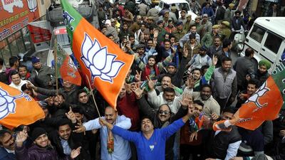 Supporters of the Bharatiya Janata Party celebrate in Jammu, the winter capital of Kashmir, as results of the state assembly election were announced on December 23, 2014. Jaipal Singh / EPA
