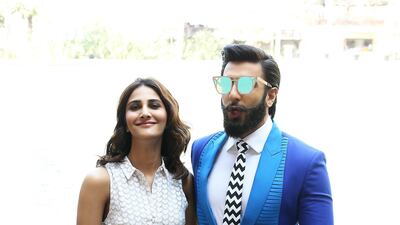 Singh, pictured with Vaani Kapoor, wore a two-tone blue suit for an appearance in Dubai in 2016. Pawan Singh / The National
