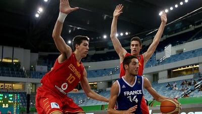 Gauthier Denis, right, and France could not find a way past Jaume Sorolla, left, and Spain in the quarter-finals of the Fiba Under 17 World Championship at Dubai. Satish Kumar / The National