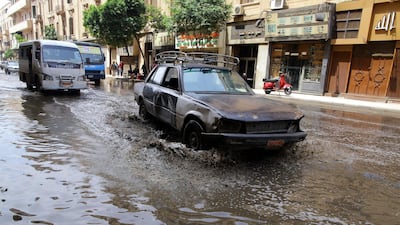 Cars drive through a flooded street after a flash flood affected Cairo, Egypt on April 26, 2018. Recent rainfalls have flooded parts of Egypt, and temperatures dropped to six degrees Celsius. Khaled Elfiqi / EPA