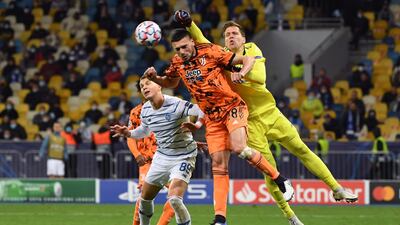 Juventus goalkeeper Wojciech Szczesny attempts to punch clear. AFP