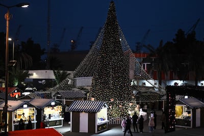 Iraqis visit a Christmas market at an amusement park in Basra. AFP