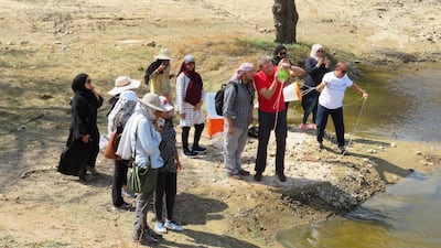 Researchers collecting mud and water samples, and the areas of water in the UAE where they took samples. Photo: Prof Waleed Hamza