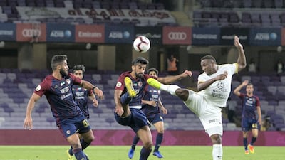 Al Wahda and Shabab Al Ahli players in action.