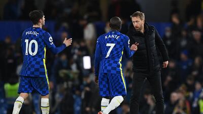Brighton manager Graham Potter shakes hands with Chelsea midfielder N'Golo Kante after the Premier League match on December 29, 2021. AFP