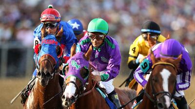 California Chrome, centre, with jockey Victor Espinoza aboard, has two jewels of the Triple Crown to his name and has only the 1.5-mile Belmont Stakes to go. But controversy awaits in New York, where the NYRA do not allow the nasal strips the three-year-old chestnut has used during his six race win streak. Matthew Stockman / AFP