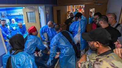 Medical staff care for victims after the Israeli military struck a Beirut's southern suburb at Bahman hospital. AFP