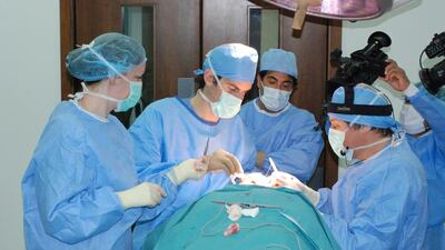 Doctors perform cosmetic surgery at the American Academy of Cosmetic Surgery Hospital in Dubai. Courtesy AACSH